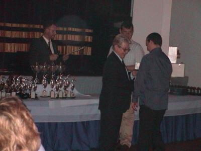 Sponsor, Ray Harvey presenting another trophy.